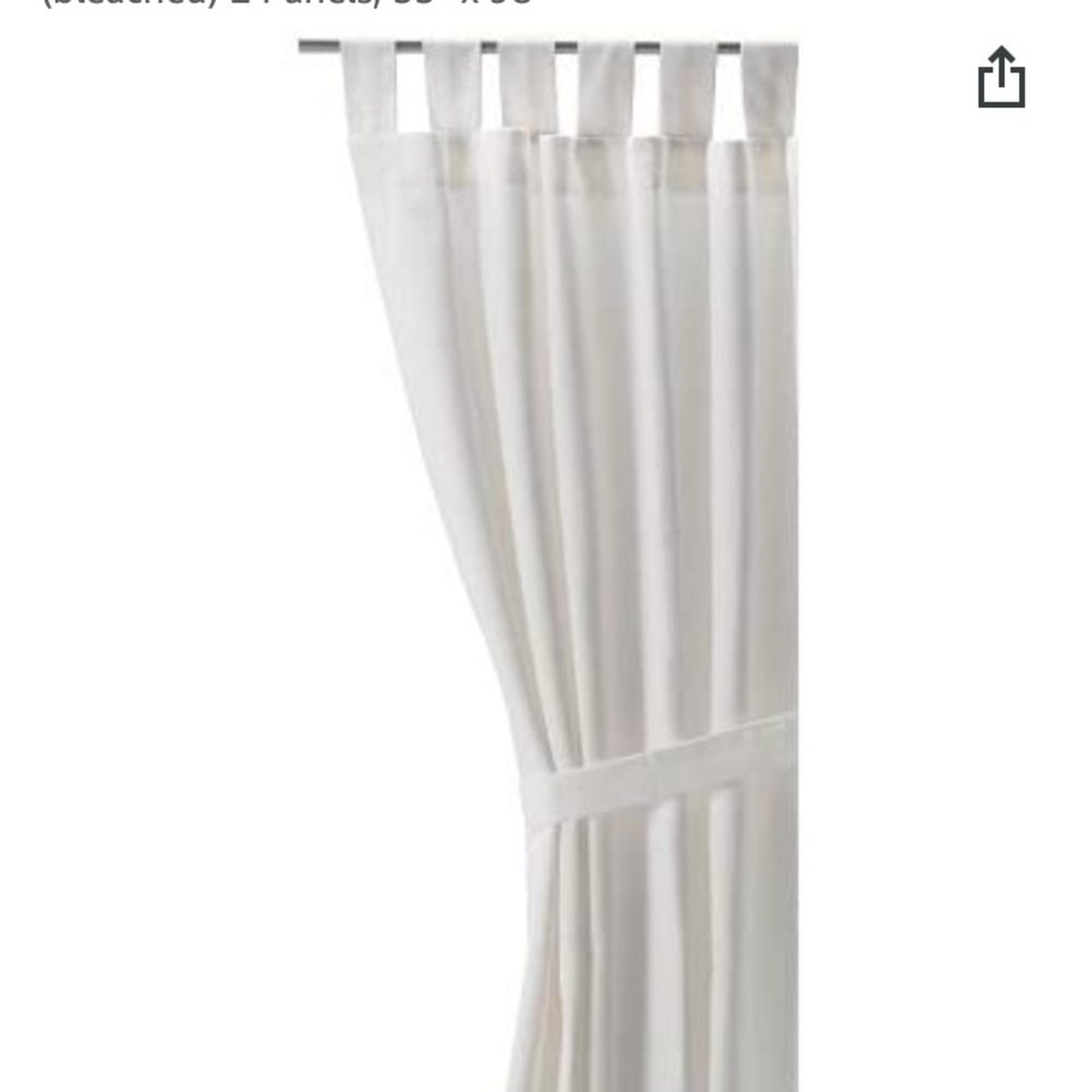White IKEA linen panel curtains.